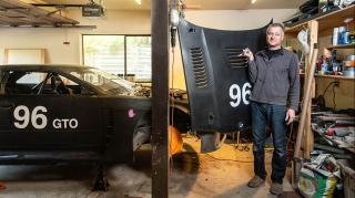 Andre Marziali posing with car hood