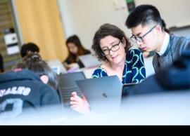 Joanne Fox talking with student