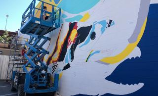 The mural represents a CTQ Consultants engineering project that helped protect fish habitat at Harrison Hot Springs.