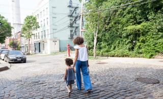 Picture of parent walking with their child