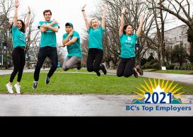 Faculty and staff jumping in celebration