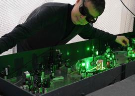 Takamasa Momose poses with the laser system