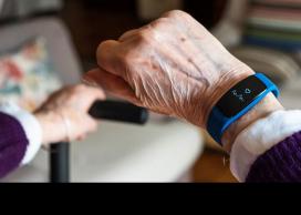 Senior showing wearable technology