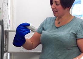 Researcher with freezer