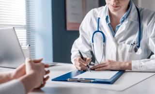 Doctor writing notes