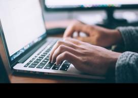 Student typing on keyboard